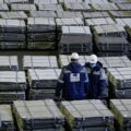 A view shows two workers inspecting nickel sheets in Russia