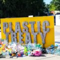A man walks behind a public art installation by Canadian artist Benjamin Von Wong that aims to highlight the problem posed by plastic pollution ahead of the fifth resumed session of Intergovernmental Negotiating Committee 5.2 (INC5.2)