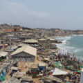 A view of Cape Coast in Ghana showing makeshift buildings and small fishing boats