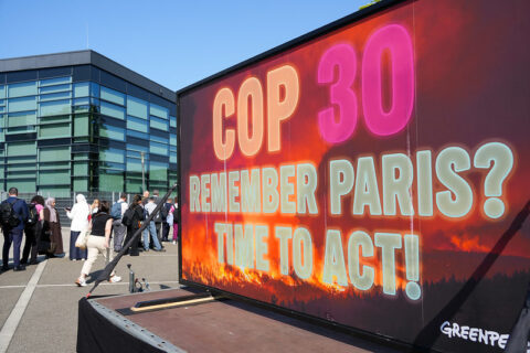 A screen displays a message to delegates lining up to enter the Bonn climate talks (Photo: 10 Billion Solutions)