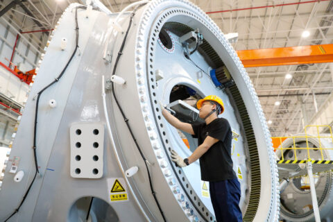 A worker processes wind turbine hubs in the workshop of Sany Heavy Energy (Rizhao) Wind Power Intelligent Manufacturing Base in Rizhao City, Shandong Province, China