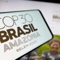In this photo illustration, a smartphone with the logo of UN climate change conference COP30 in Brazil is seen on screen in front of website.