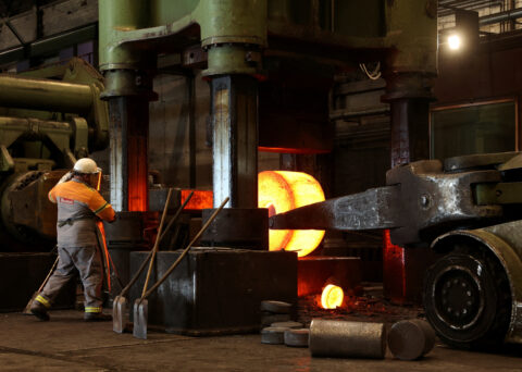 An employee of Dirostahl, a medium-size forging steel firm that produces large parts, works on a glowing steel element that has been heated in a classic natural gas-fired furnace to 1,200C in Remscheid, Germany