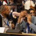 Delegates react to the suspension of the closing plenary on Thursday night at UN plastics talks in Geneva